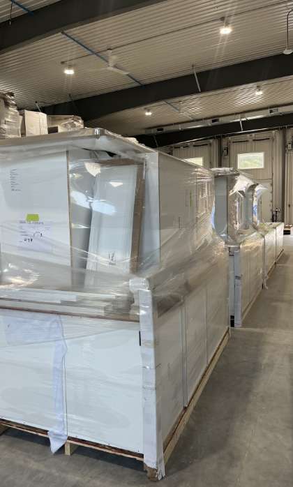 Pallets of ready-to-ship inventory at a leading wholesale kitchen cabinet supplier warehouse.